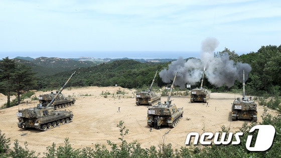 韩国陆海空三军举行联合射击演习【组图】